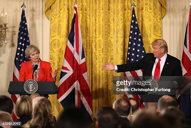 President Donald Trump gestures during a joint press conference with British Prime Minister Theresa May in The East Room at The White House on...