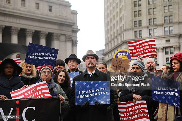 Area Muslims and local immigration activists participate in a prayer and rally against President Donald Trump's immigration policies on January 27,...