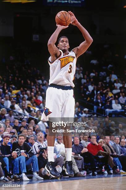 Jacque Vaughn of the Golden State Warriors shoots against the New Jersey Nets during a game played on November 25, 1997 at the Arena in Oakland in...