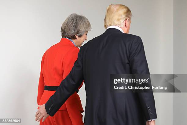 British Prime Minister Theresa May with U.S. President Donald Trump as they walk along The Colonnade at The White House on January 27, 2017 in...