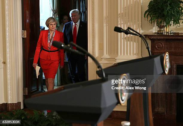 President Donald Trump and British Prime Minister Theresa May approach the podiums for a joint press conference in the East Room of the White House...