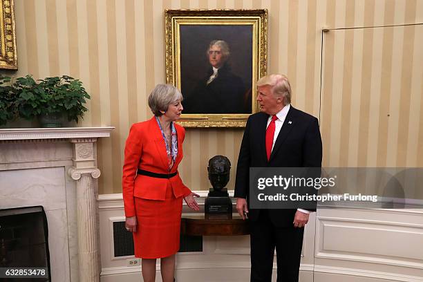 British Prime Minister Theresa May speaks to with U.S. President Donald Trump in The Oval Office at The White House on January 27, 2017 in...