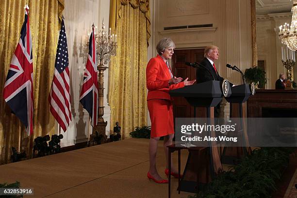 President Donald Trump and British Prime Minister Theresa May participate in a joint press conference in the East Room of the White House January 27,...