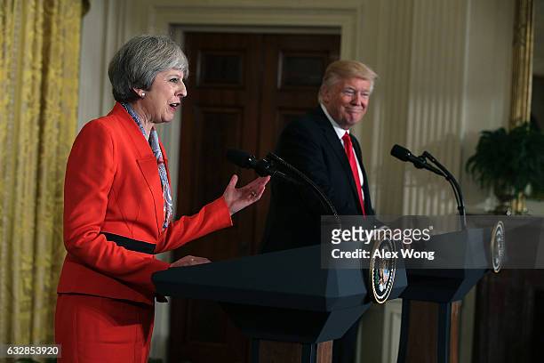 President Donald Trump and British Prime Minister Theresa May participate in a joint press conference in the East Room of the White House January 27,...
