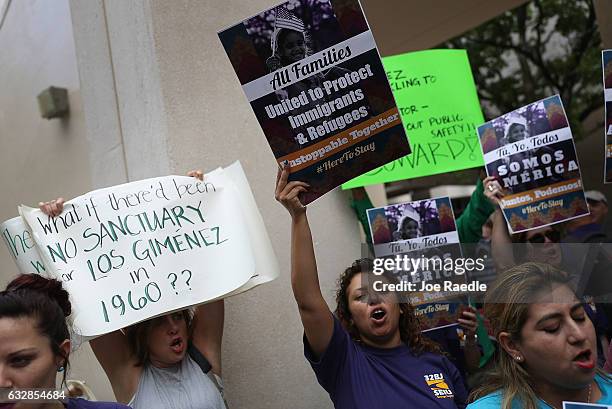 Protesters against Miami-Dade Mayor Carlos Gimenez's decision to abide by President Donald Trump's order, that any "sanctuary" cities could possibly...