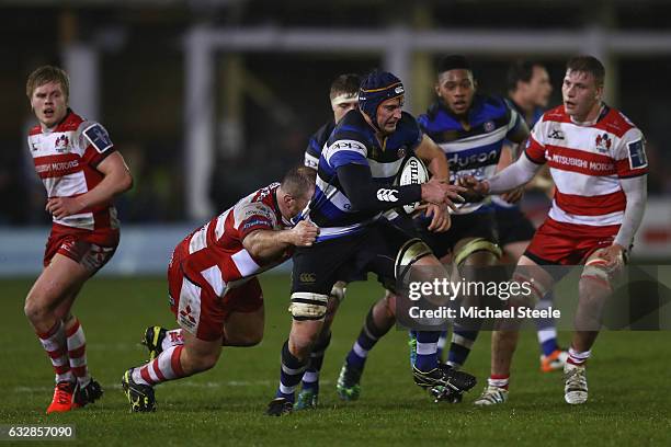 Paul Grant of Bath is tackled by Yann Thomas of Gloucester during the Anglo Welsh Cup match between Bath Rugby and Gloucester Rugby at the Recreation...