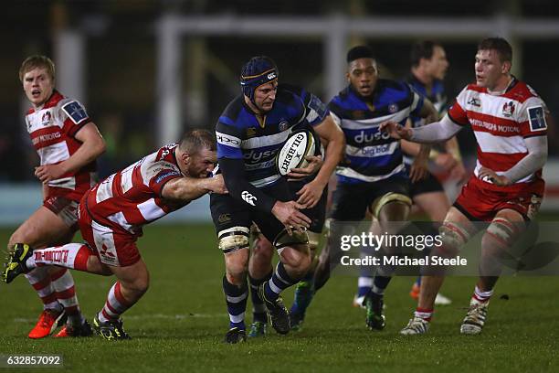 Paul Grant of Bath is tackled by Yann Thomas of Gloucester during the Anglo Welsh Cup match between Bath Rugby and Gloucester Rugby at the Recreation...