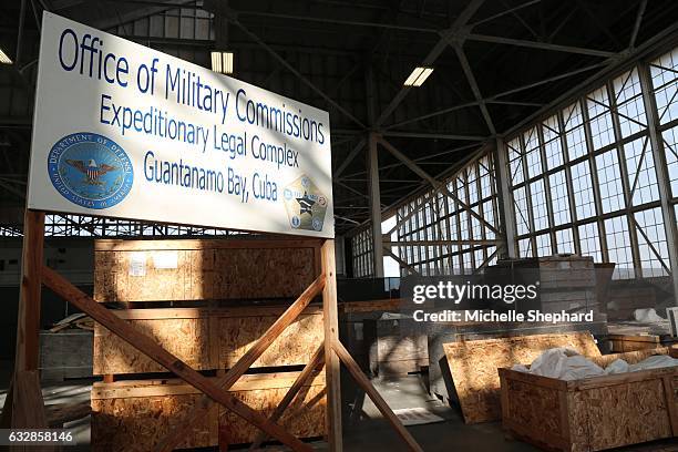 Sign inside a hangar at "Camp Justice," where the U.S. Naval Base's war crimes trials are held. U.S. President Donald Trump has vowed to keep the...