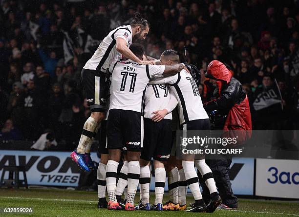 Derby's Scottish defender Craig Bryson celebrates with teammates after scoring their second goal during the English FA Cup fourth round football...