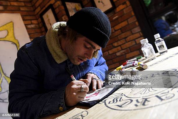 Artist Matt Digiacomo signs autographs during the 'Pete Punk Offspring And Artist Matt Digiacomo Converge' at Chrome Hearts Tokyo on January 27, 2017...
