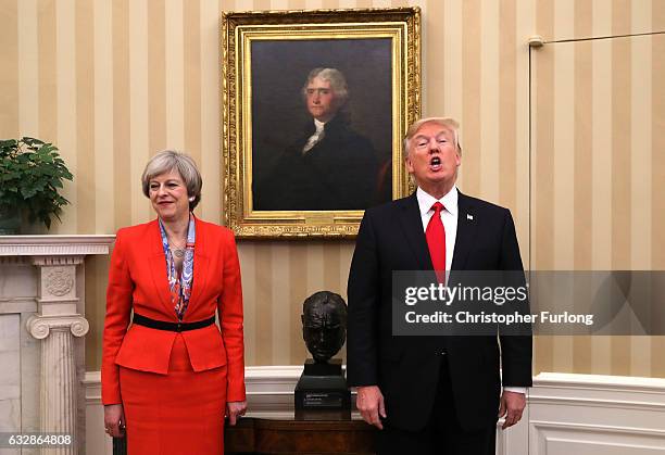 British Prime Minister Theresa May looks on as U.S. President Donald Trump speaks in The Oval Office at The White House on January 27, 2017 in...