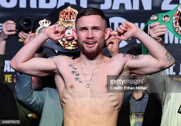 Featherweight champion Carl Frampton poses on the scale during his official weigh-in at MGM Grand Garden Arena on January 27, 2017 in Las Vegas,...