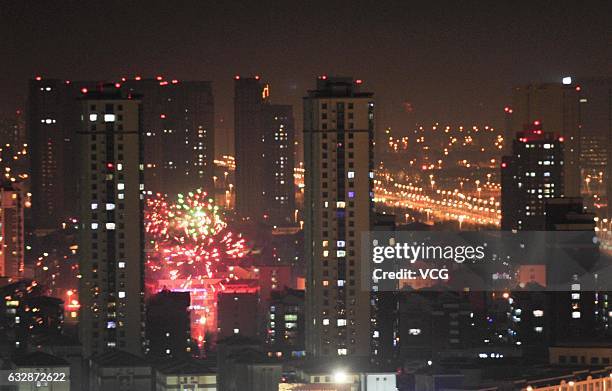 Fireworks light up the skyline on the eve of Lunar New Year to mark the Year of the Rooster on January 27, 2017 in Shenyang, Liaoning Province of...