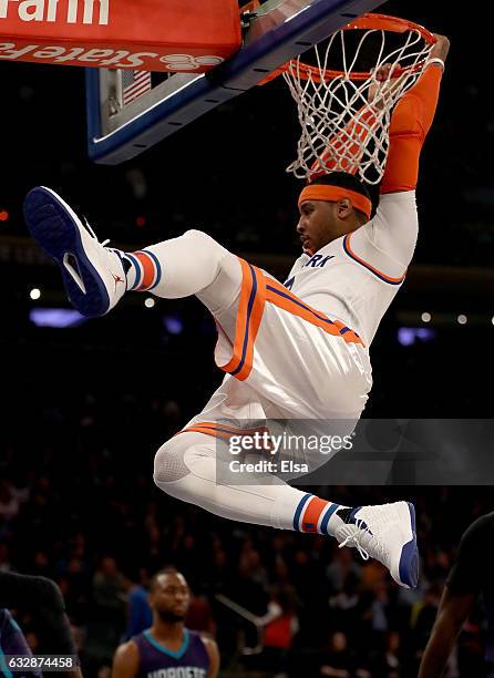 Carmelo Anthony of the New York Knicks dunks in the third quarter against the Charlotte Hornets at Madison Square Garden on January 27, 2017 in New...