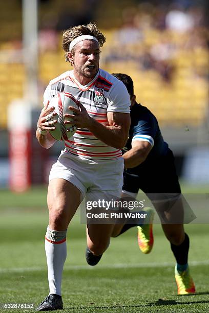 Tom Mitchell of England is tackled in the match between England and Argentina during the 2017 Wellington Sevens at Westpac Stadium on January 28,...