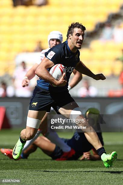 Felipe del Mestre of Argentina is tackled in the match between England and Argentina during the 2017 Wellington Sevens at Westpac Stadium on January...