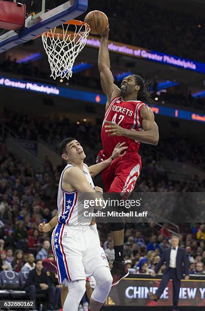 Nene Hilario of the Houston Rockets dunks the ball against Ersan Ilyasova of the Philadelphia 76ers in the third quarter at the Wells Fargo Center on...