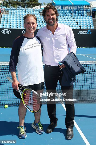 Federal Minister for Health and Minister for Sport Greg Hunt poses with Pat Rafter during day thirteen of the 2017 Australian Open at Melbourne Park...