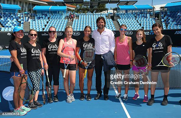 Pat Rafter poses with a group of girls who took part in a cardio tennis session during day thirteen of the 2017 Australian Open at Melbourne Park on...