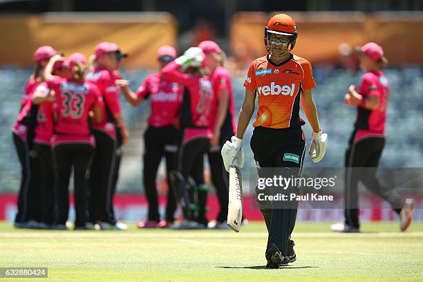 Lauren Ebsary of the Scorchers walks back to the dug out after being run-out by Marizanne Kapp of the Sixers during the Women's Big Bash League match...