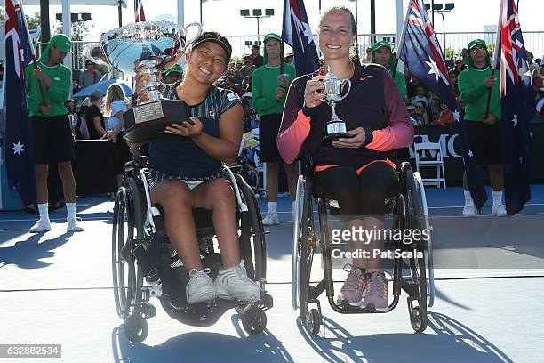 Yui Kamiji of Japan celebrates with the trophy after winning the Women's Wheelchair Singles Final against Jiske Griffioen of the Netherlands, holding...