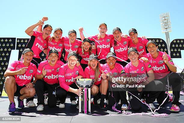 The Sixers celebrate with the trophy after winning the Women's Big Bash League match between the Perth Scorchers and the Sydney Sixers at WACA on...