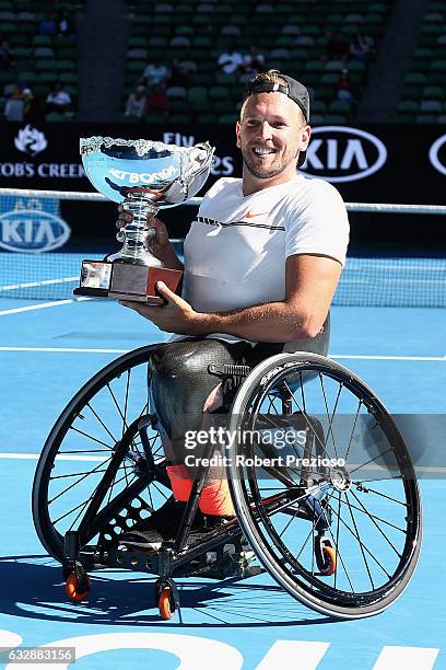 Dylan Alcott of Australia poses with the championship trophy after winning his Quad Wheelchair Singles Final against Andy Lapthorne of Great Britain...