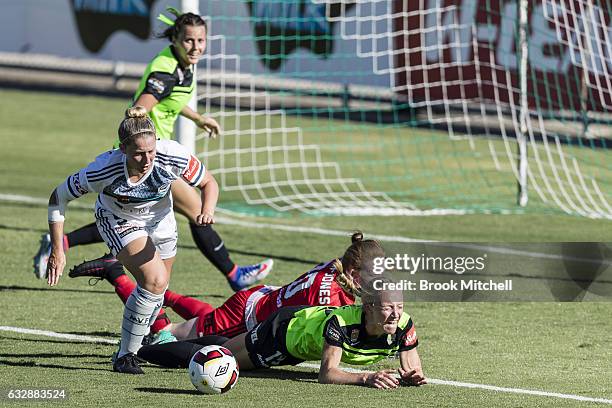 Melbourne Victory keeper Emily Kenshole colides with Canberra United's Nickoletta Flannery and Victory's Alexandra Gummer during the round 14...