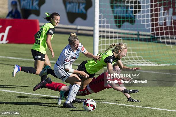 Melbourne Victory keeper Emily Kenshole colides with Canberra United's Nickoletta Flannery and Victory's Alexandra Gummer during the round 14...