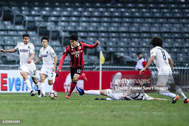 Seoul Midfielder Go Yo Han trips up with Auckland City Midfielder Fabrizio Tavano during the 2017 Lunar New Year Cup match between Auckland City FC...