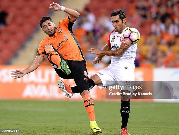 Dimitri Petratos of the Roar is fouled by Dimas Delgado of the Wanderers during the round 17 A-League match between the Brisbane Roar and the Western...