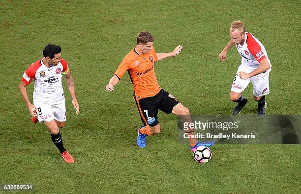 Thomas Kristensen of the Roar takes on the defence during the round 17 A-League match between the Brisbane Roar and the Western Sydney Wanderers at...