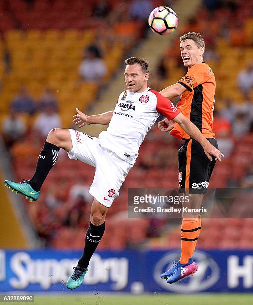 Thomas Kristensen of the Roar and Brendan Santalab of the Wanderers compete for the ball during the round 17 A-League match between the Brisbane Roar...