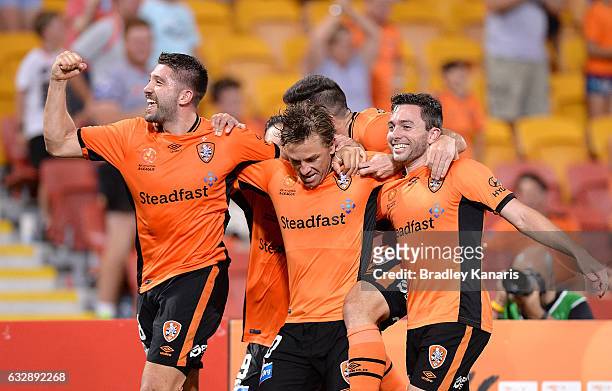 Brett Holman of the Roar is congratulated by team mates after scoring a goal during the round 17 A-League match between the Brisbane Roar and the...