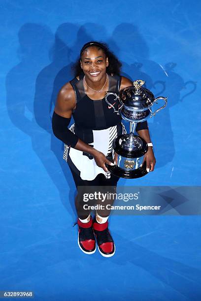 Serena Williams of the United States poses with the Daphne Akhurst Trophy after winning the Women's Singles Final against Venus Williams of the...