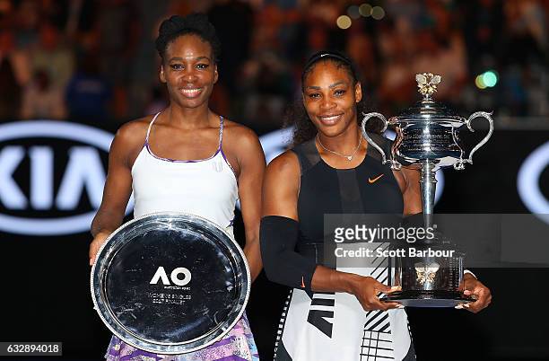 Serena Williams poses with the Daphne Akhurst Trophy after winning the Women's Singles Final against Venus Williams of the United States, posing with...
