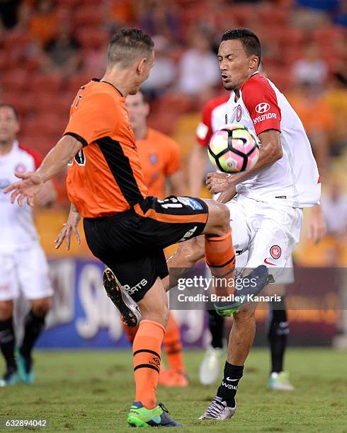 Jade North of the Roar and Kearyn Baccus of the Wanderers challenge for the ball during the round 17 A-League match between the Brisbane Roar and the...