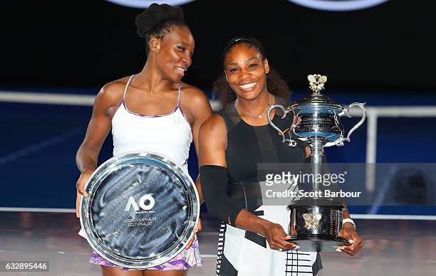 Serena Williams poses with the Daphne Akhurst Trophy after winning the Women's Singles Final against Venus Williams of the United States, posing with...