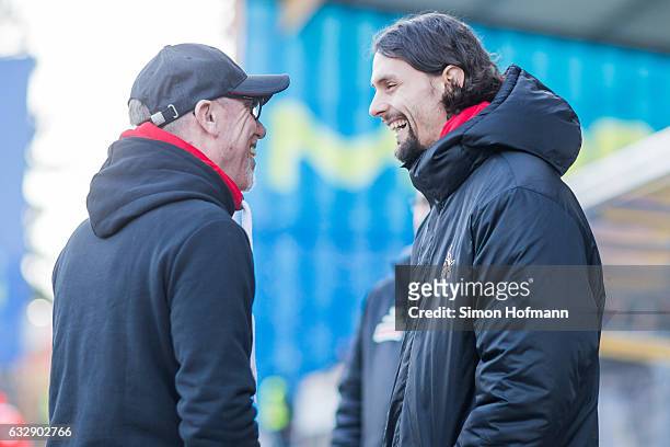 Neven Subotic of Koeln smiles as he chats with Head coach Peter Stoeger prior to the Bundesliga match between SV Darmstadt 98 and 1. FC Koeln at...