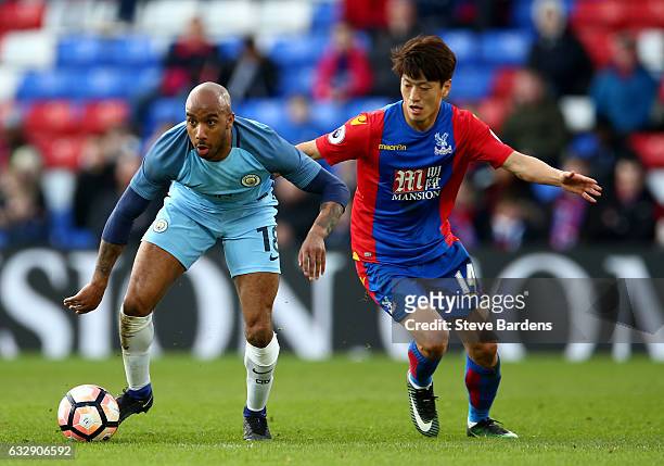 Fabian Delph of Manchester City and Chung-yong Lee of Crystal Palace in action during the Emirates FA Cup Fourth Round match between Crystal Palace...