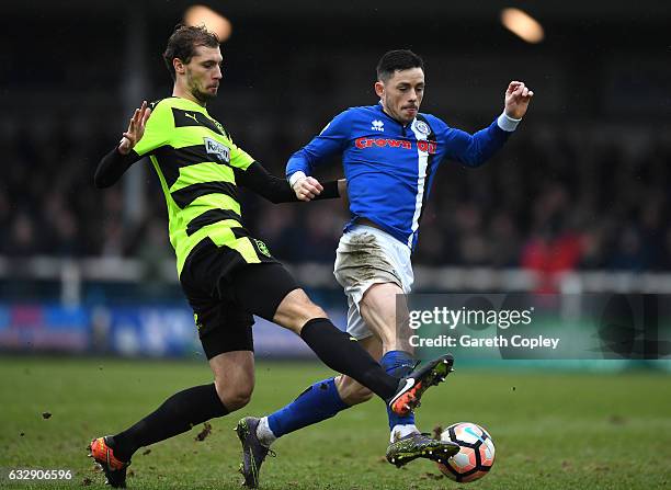 Jon Gorenc Stankovic of Huddersfield Town and Callum Camps of Rochdale compete for the ball during the Emirates FA Cup Fourth Round match between...