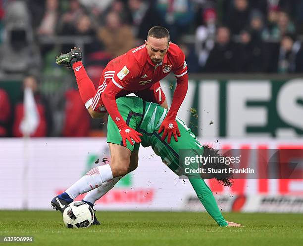 Franck Ribery of Muenchen is challenged by Thomas Delaney of Bremen during the Bundesliga match between Werder Bremen and Bayern Muenchen at...