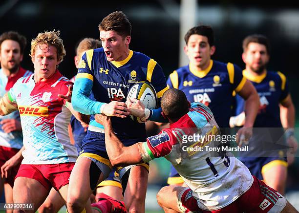 Ben Howard of Worcester Warriors is tackled by Aaron Morris of Harlequins during the Anglo-Welsh Cup match between Worcester Warriors and Harlequins...