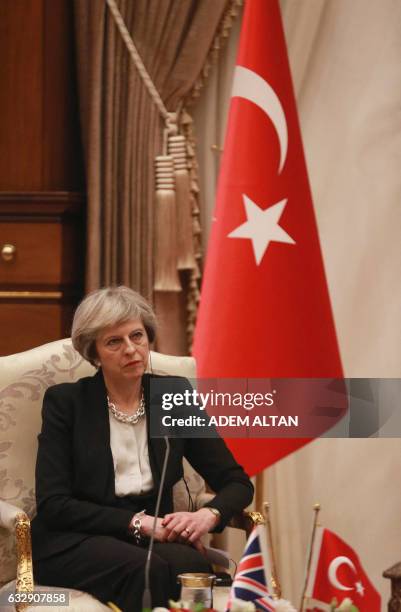 British Prime Minister Theresa May looks on during a meeting with Turkey's President Recep Tayyip Erdogan at the presidential complex in Ankara on...