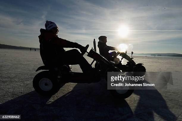 People drive over the ice on Lake Ammersee on January 28, 2017 in Stegen am Ammersee, Germany. After an unusual cold winter period currently most of...