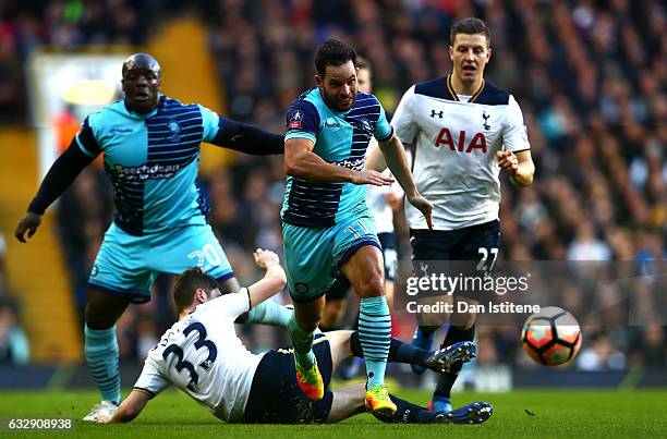 Sam Wood of Wycombe Wanderers skips past Ben Davies of Tottenham Hotspur during the Emirates FA Cup Fourth Round match between Tottenham Hotspur and...