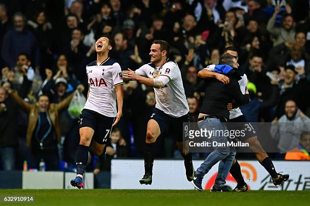 Heung-Min Son of Tottenham Hotspur celebrates with Vincent Janssen of Tottenham Hotspur after scoring his sides fourth goal during the Emirates FA...
