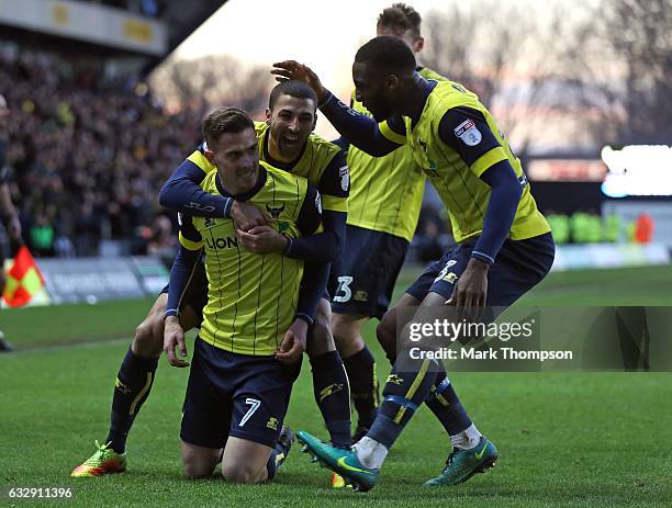 Toni Martinez of Oxford United celebrates scoring his side's third goal with his team mates during the Emirates FA Cup Fourth Round match between...