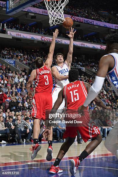 Dario Saric of the Philadelphia 76ers drives to the basket and shoots the ball against the Houston Rockets at Wells Fargo Center on January 27, 2017...