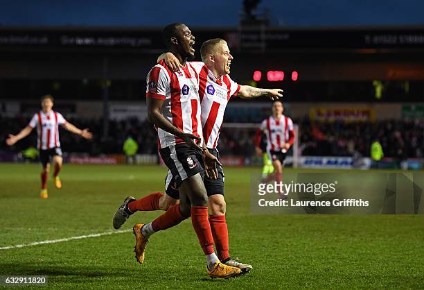 Theo Robinson of Lincoln Citycelebrates scoring his side's third goal during the Emirates FA Cup Fourth Round match between Lincoln City and Brighton...